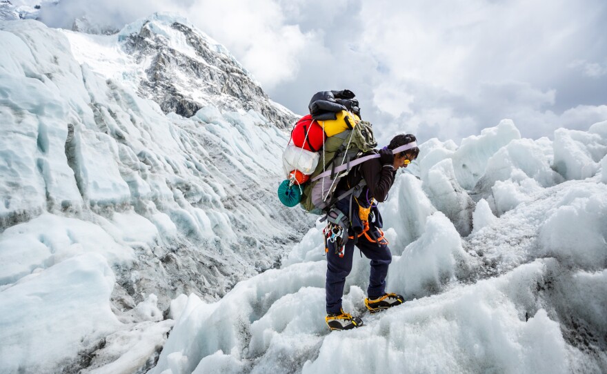 A sherpa on the Khumbu Ice Fall — an obstacle faced on Mt. Everest.