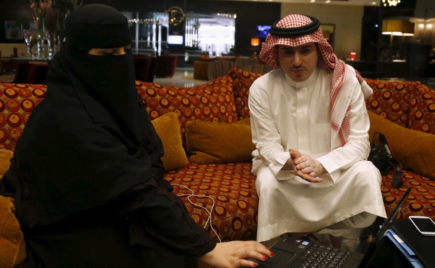Fawzia al-Harbi, a candidate in Saudi local municipal council elections, was accompanied by a male chaperone during a campaign visit to a Riyadh shopping mall on Sunday. Saudi women are running for election and will be able to vote for the first time on Dec. 12.