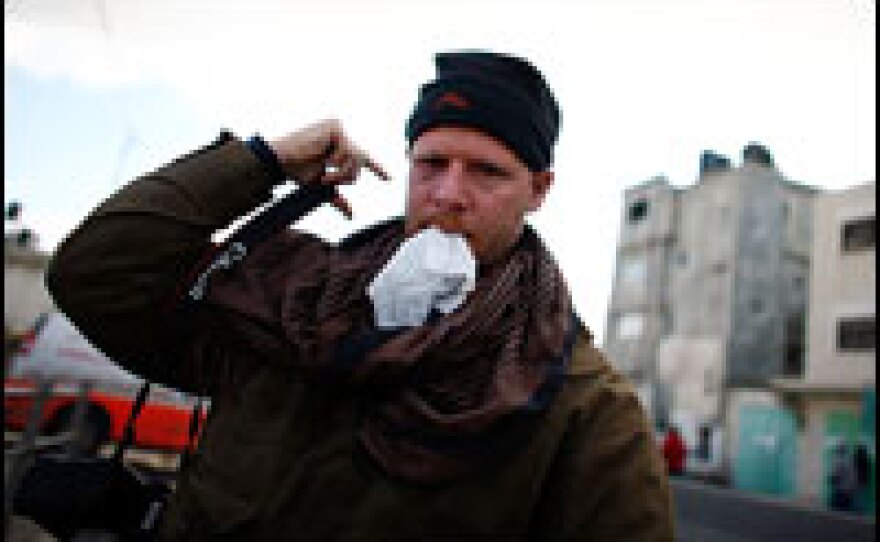 "I have a towel in my mouth because I was using it to get the gas out of my face, eyes and mouth," David Gilkey says. "It burns your lips so you suck on a dry towel. It helps the stinging stop."