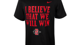 A T-shirt emblazoned with the chant, "I Believe That We Will Win!" is sold by Atzec Shops Ltd., a nonprofit operating at San Diego State University. 