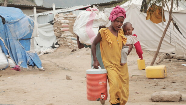 A displaced person walks through a camp in Taiz province, Yemen, Tuesday, Sept. 15, 2026.