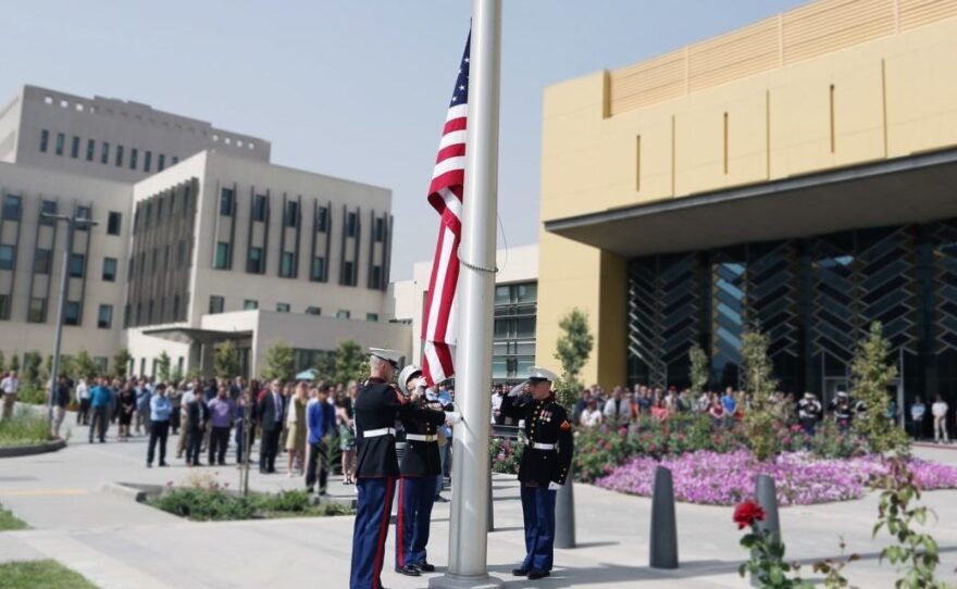 Marine guards at the Sept. 11, 2017, flag ceremony in the U.S. Embassy compound in Kabul, Afghanistan. An internal State Dept. memo says it is the largest U.S. embassy in the world.