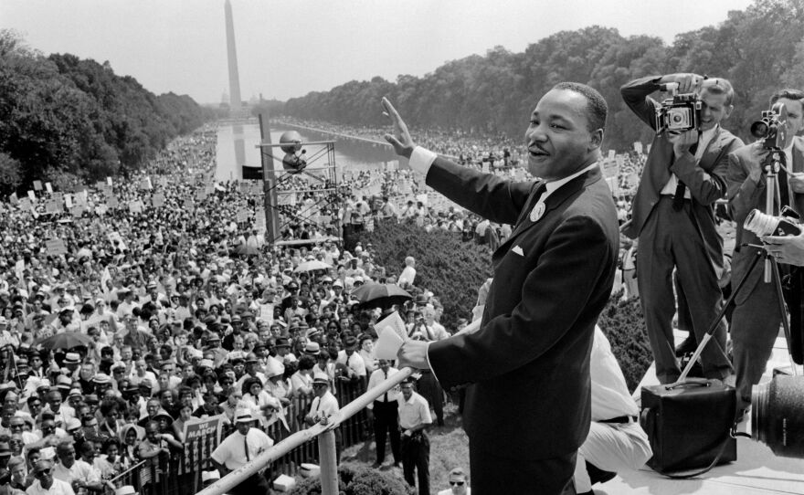 The civil rights leader Martin Luther King Jr. waves to supporters on Aug. 28, 1963, on the Mall in Washington, D.C., during the March on Washington.