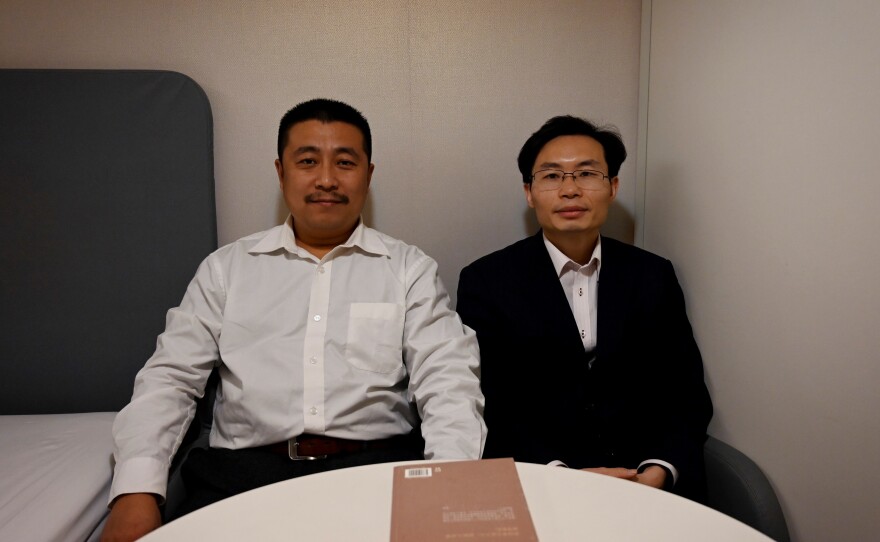 Lawyers Ren Quanniu (left) and Zhang Keke representing Chinese citizen journalist Zhang Zhan, who reported on Wuhan's coronavirus outbreak and was detained in May, during an interview with Agence France-Presse on Dec. 27 in Shanghai ahead of their client's trial.