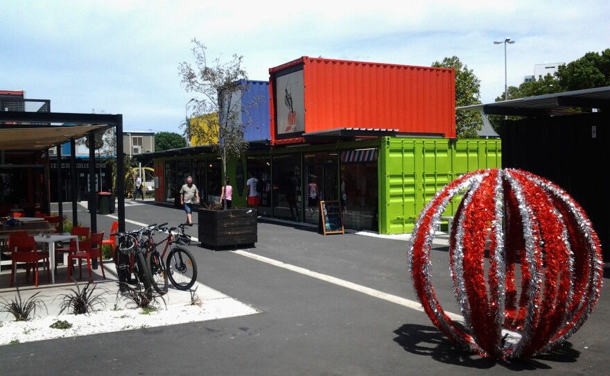 Pop-up stores and cafes in shipping containers cheer up the center of the earthquake-battered city.