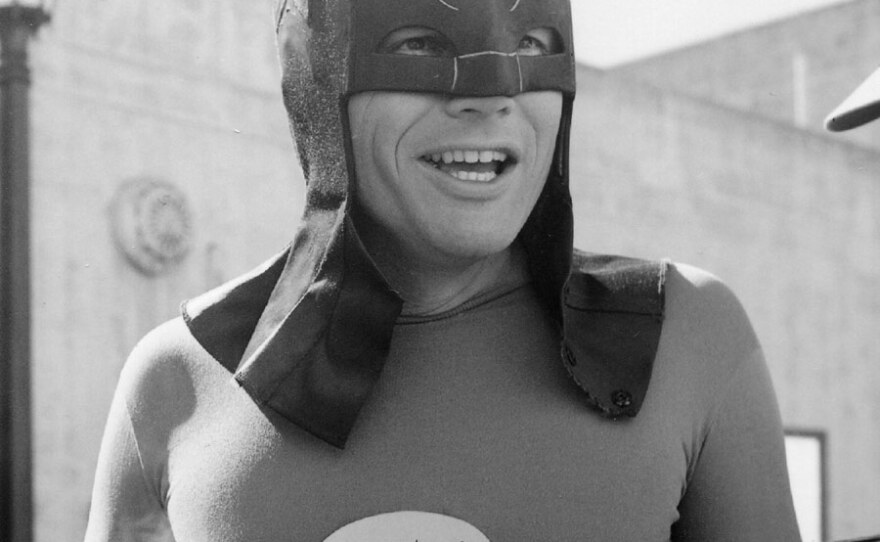 Adam West enjoys his morning coffee before a day of shooting on the 1960s BATMAN television series.