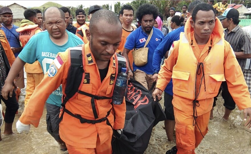 Rescuers are recovering victims and searching for survivors of flash floods in Papua province, Indonesia.