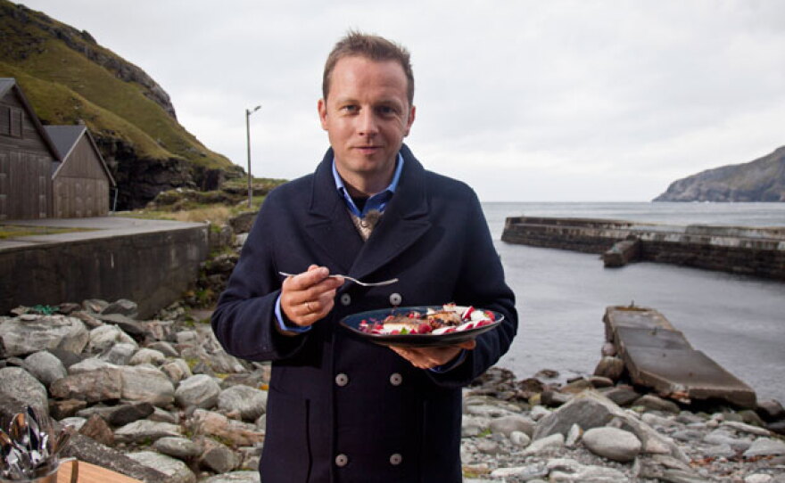 Host Andreas Viestad eats a brightly colored salad with smoked haddock while visiting the wind-blown peninsula of Stad in Western Norway.
