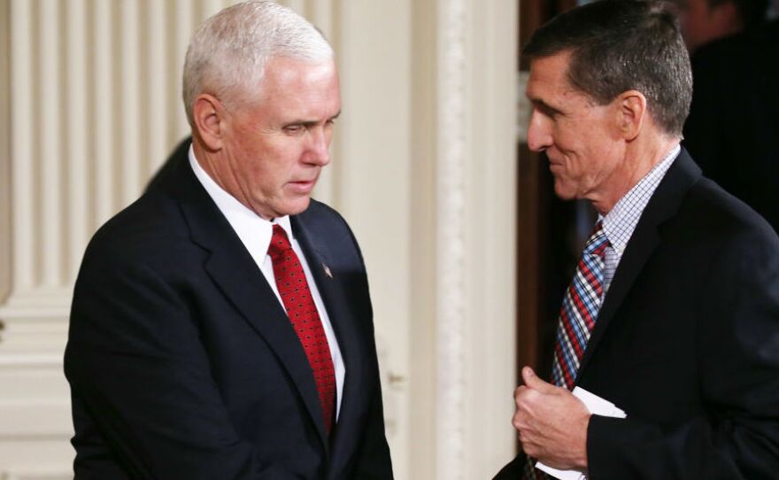 National security adviser Michael Flynn (right) has resigned amid allegations he misled then-Vice President-elect Pence (left) about the extent of a conversation he had with the Russian ambassador.