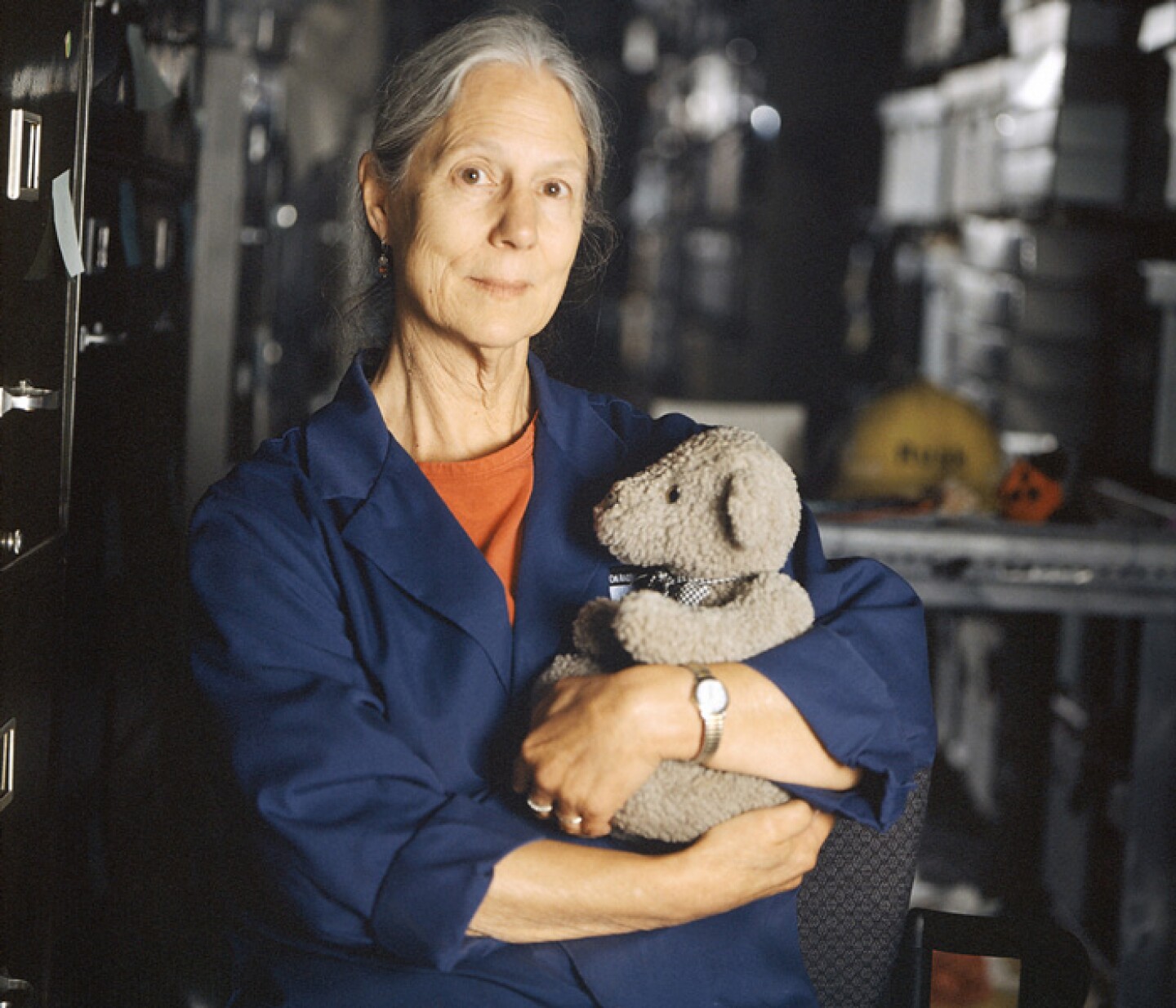 Jane Thomas, Collections Manager, Oklahoma City National Memorial, holds Murray, her companion as she went through the debris from the Alfred P. Murrah Federal Building (Oklahoma City bombing site) and items left behind on the fence surrounding it.