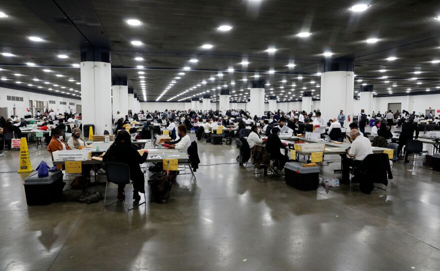 Detroit election workers count absentee ballots for the 2020 general election at TCF Center on Nov. 4. Election offices around the U.S. say they couldn't have carried out this year's challenging election without help from a nonprofit tied to Facebook CEO Mark Zuckerberg.