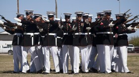 The Marine Corps Silent Drill Platoon executes its "bursting bomb" formation during a Battle Color Detachment ceremony at Marine Corps Air Station Yuma, Ariz., March 1, 2012.