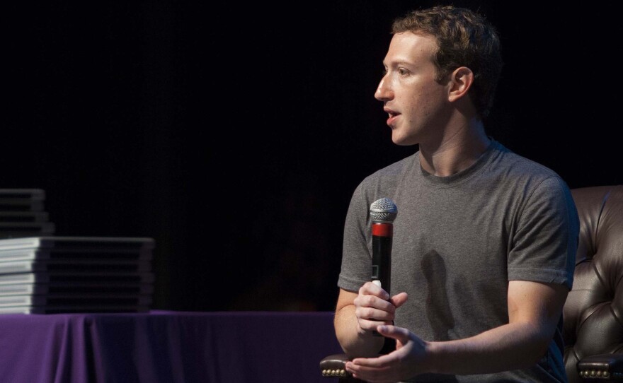 Facebook CEO Mark Zuckerberg speaks to students at Sequoia High School in Redwood City, Calif. His company released a new, simpler privacy policy Thursday, but it does not make any big changes to how much data the company collects from users.