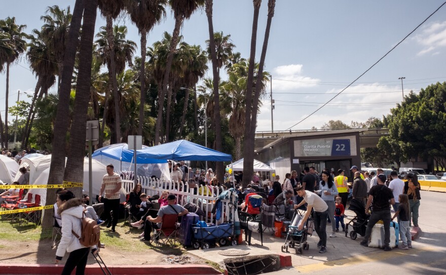 Ukrainian war refugees turn a Tijuana bus stop into a make-shift camp to wait it for their turn to claim asylum in the United States, April 1 ,2022.