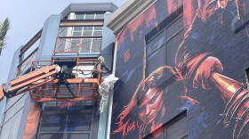Crews taking down the building wraps in downtown San Diego after Comic-Con ended, July 27, 2026.