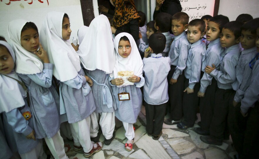 Gilkey would make kids laugh —  and then they'd be willing to let him take their picture. Above: schoolkids in Kabul, Afghanistan, in May 2015.