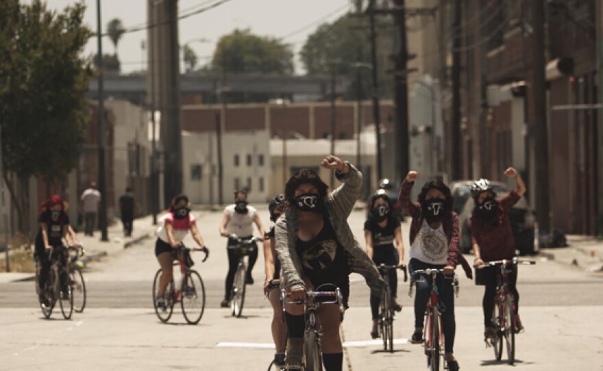 Evie leads the Ovarian Psycos. Young women of color take to the streets of East Los Angeles – on bicycles – to confront racism and violence and create safe spaces for women.