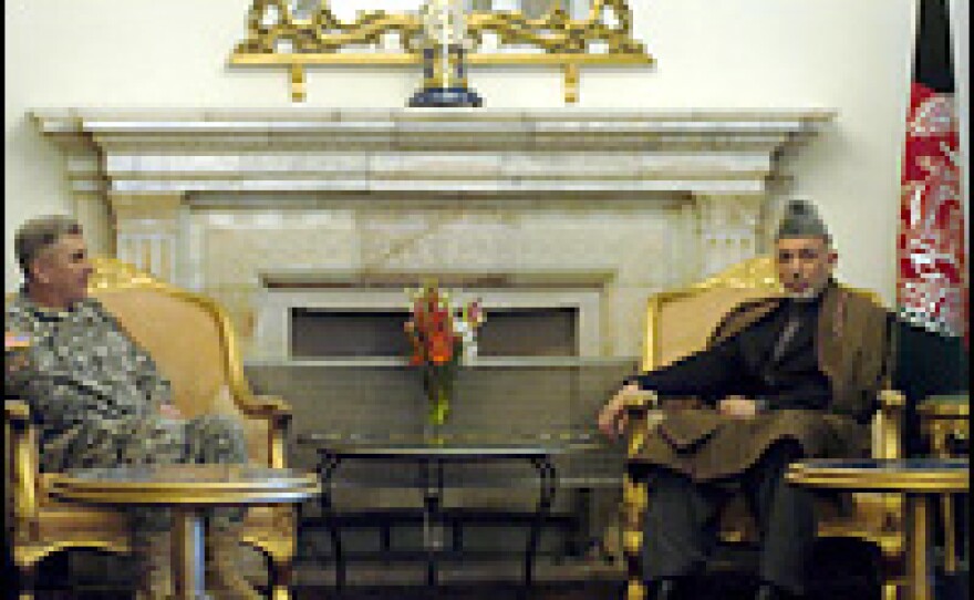Afghan president Hamid Karzai (right) meets Lt. Gen. Karl Eikenberry at the Presidential Palace in Kabul on Jan. 20, 2007.