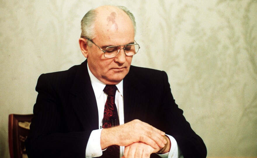Soviet President Mikhail Gorbachev checks the time on his watch before his resignation speech in the Kremlin on Wednesday, Dec. 25, 1991.