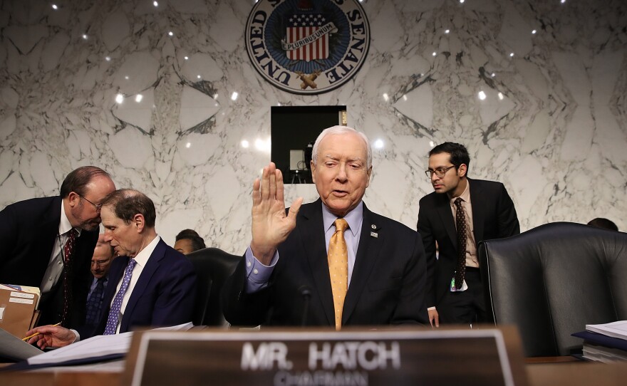 Senate Finance Committee chairman Orrin Hatch (R-Utah) gestures before a committee meeting on Nov. 15 in Washington, D.C.