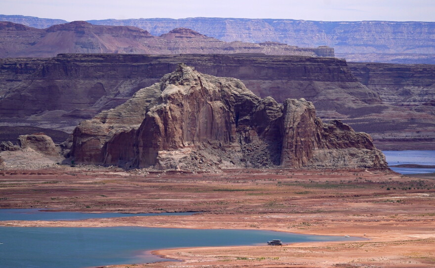 Low water levels at Wahweap Bay at Lake Powell along the Upper Colorado River Basin are pictured, June 9, 2021, at the Utah and Arizona border at Wahweap, Ariz.