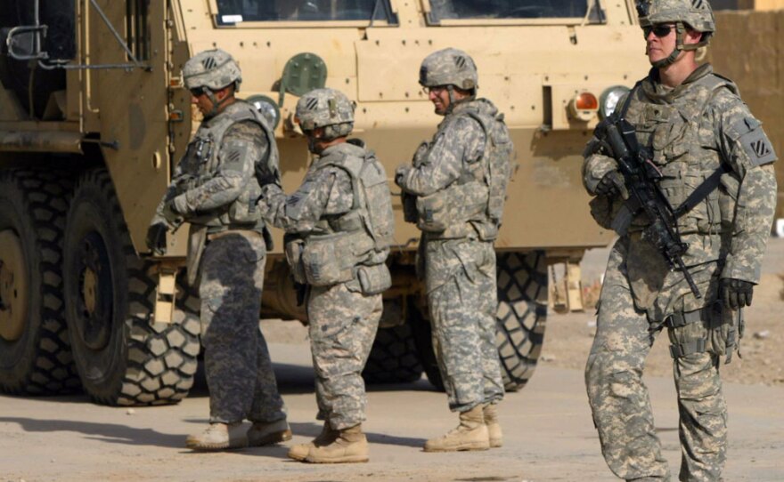 U.S. troops patrol in the Iraqi city of Kirkuk on August 26.  They will remain after President Obama declares the end of the U.S. combat mission in Iraq.