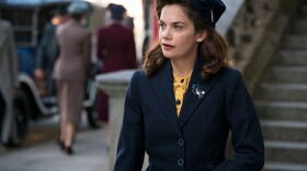 Ruth Wilson as Alison Wilson, a recent widow who discovers her spy novelist husband lived a double life. Determined to uncover the truth about the man she loved, she soon finds herself at the center of a mystery that proves truth can be stranger than fiction.