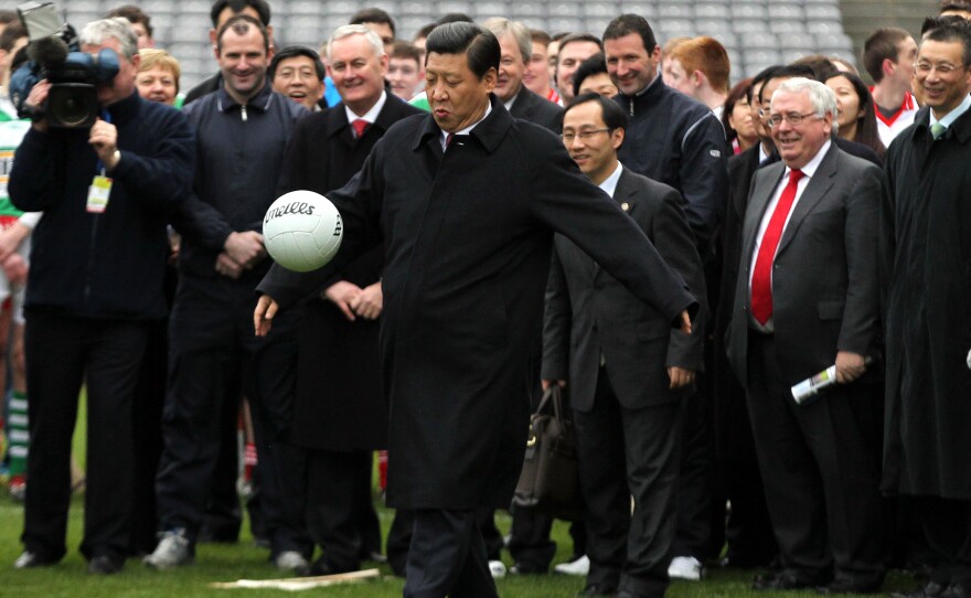 Xi Jinping, an avowed soccer fan, kicks a soccer ball during a 2012 trip to Dublin when he was China's vice president. Xi became president the following year.