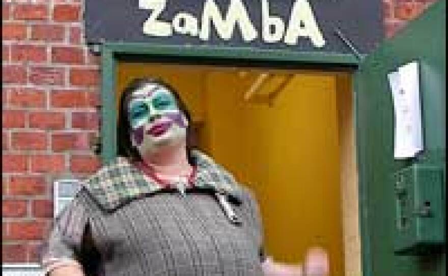 Welcome to Ramba Zamba! Franziska Kleinert, who plays Kommissar XXL in <em>Mongopolis</em>, stands outside the group's theater building.