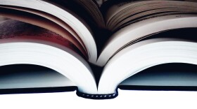 Books stacked on white background in this undated photo.