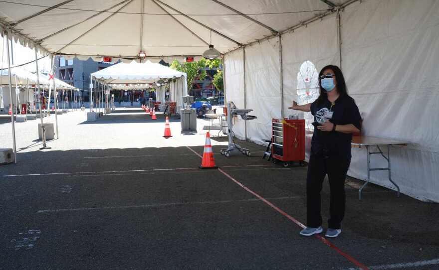 Lydia Ikeda gives a tour of the Vaccination Super Station near Petco Park. Jan. 10, 2021.