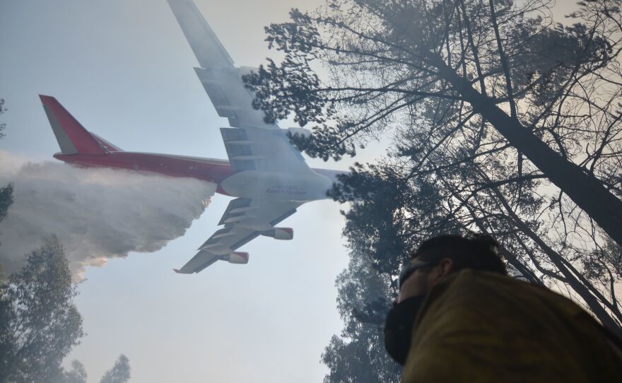 A Boeing 747 firefighting plane helps put out a forest fire in Concepcion, Chile, on Saturday.