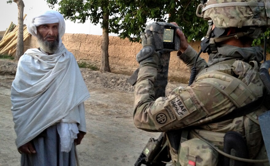 U.S. soldiers arrive early in the morning in the eastern village of Bagi Kheyl in an effort to surprise any potential Taliban. They walk through the village, taking down residents' information and searching for signs of the Taliban.
