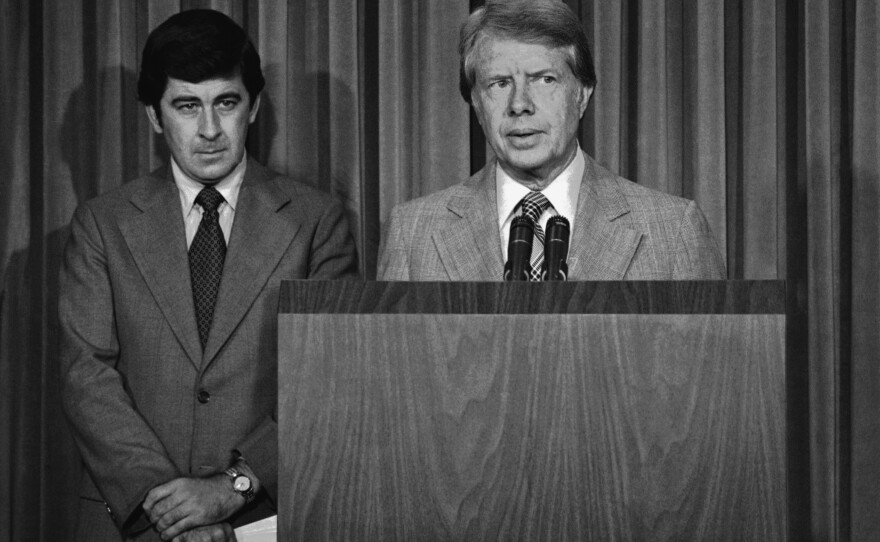 President Jimmy Carter, with his special assistant for health issues, Dr. Peter Bourne, beside him, talks briefly to reporters at the White House in Washington Tuesday, August 2, 1977, about his drug abuse control message to Congress. Among other things, he called for the elimination of all federal criminal penalties for the possession of up to one ounce of marijuana.