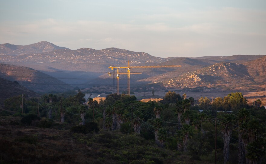 A development of almost 3,000 homes planned for a valley in Santee, Calif., has ignited a debate in the community about housing and wildfire risk.