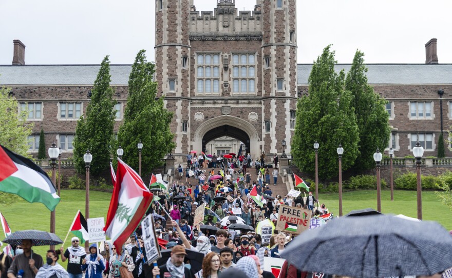 Pro-Palestinian demonstrators march through Brookings Hall on Saturday, April 27, 2024 at Washington University.