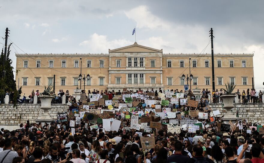 People take part in a demonstration in front of the Greek Parliament in Athens.