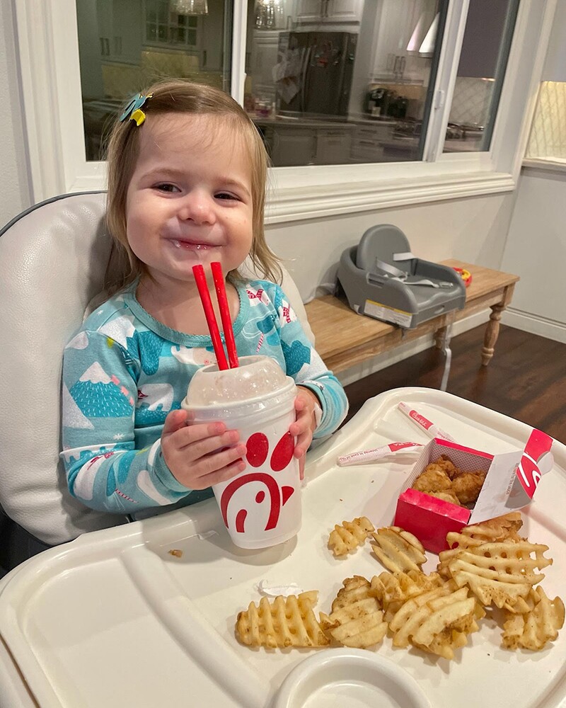 Adeline Zermeno, 2, in recovery after spending two nights in the hospital because of COVID-19. Here she is enjoying her post-hospitalization meal in this undated photo. She requested Chik-fil-A.