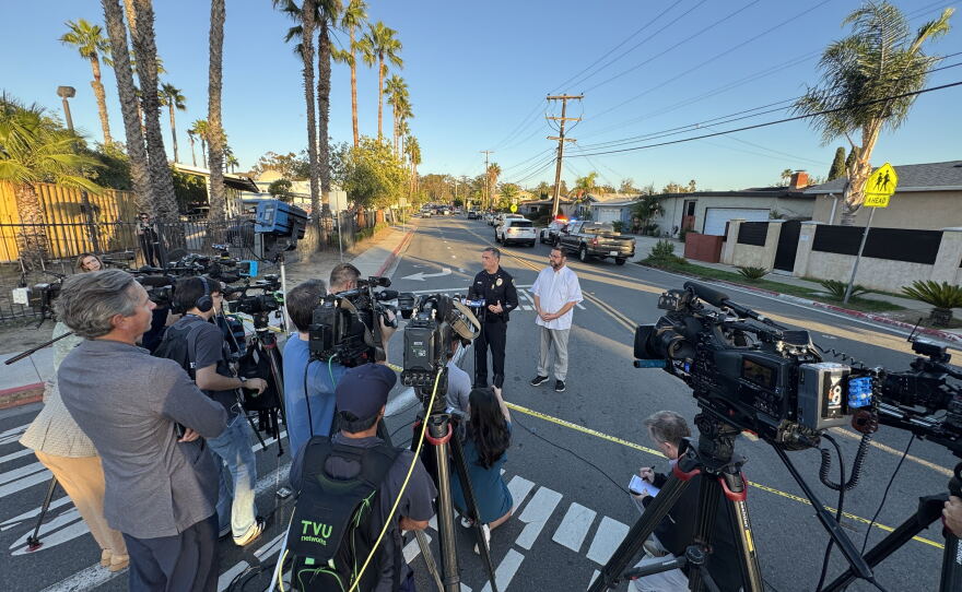 Lieutenant Cesar Jimenez speaks to the media alongside Imam Taha Hassane to give an update on the Islamic Center of San Diego lockdown, Oct. 27, 2026.