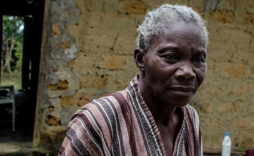 Amanda Ellis, 79, lost five members of her family to Ebola. Now, nobody will buy the mangoes that used provide her income. She must rely instead on handouts.