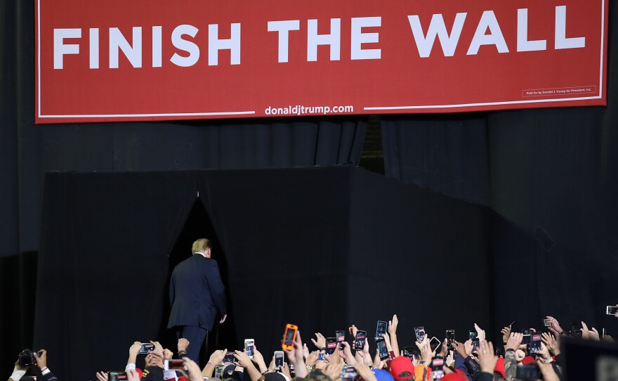 President Trump walks offstage after speaking during a rally Monday in El Paso, Texas.