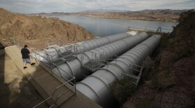Mechanic John Harper walks onto the pipes conveying water pumped from the Colorado River at the Metropolitan Water District of Southern California's Whitsett Intake Pumping Plant near Parker Dam, California, Oct. 15, 2015.