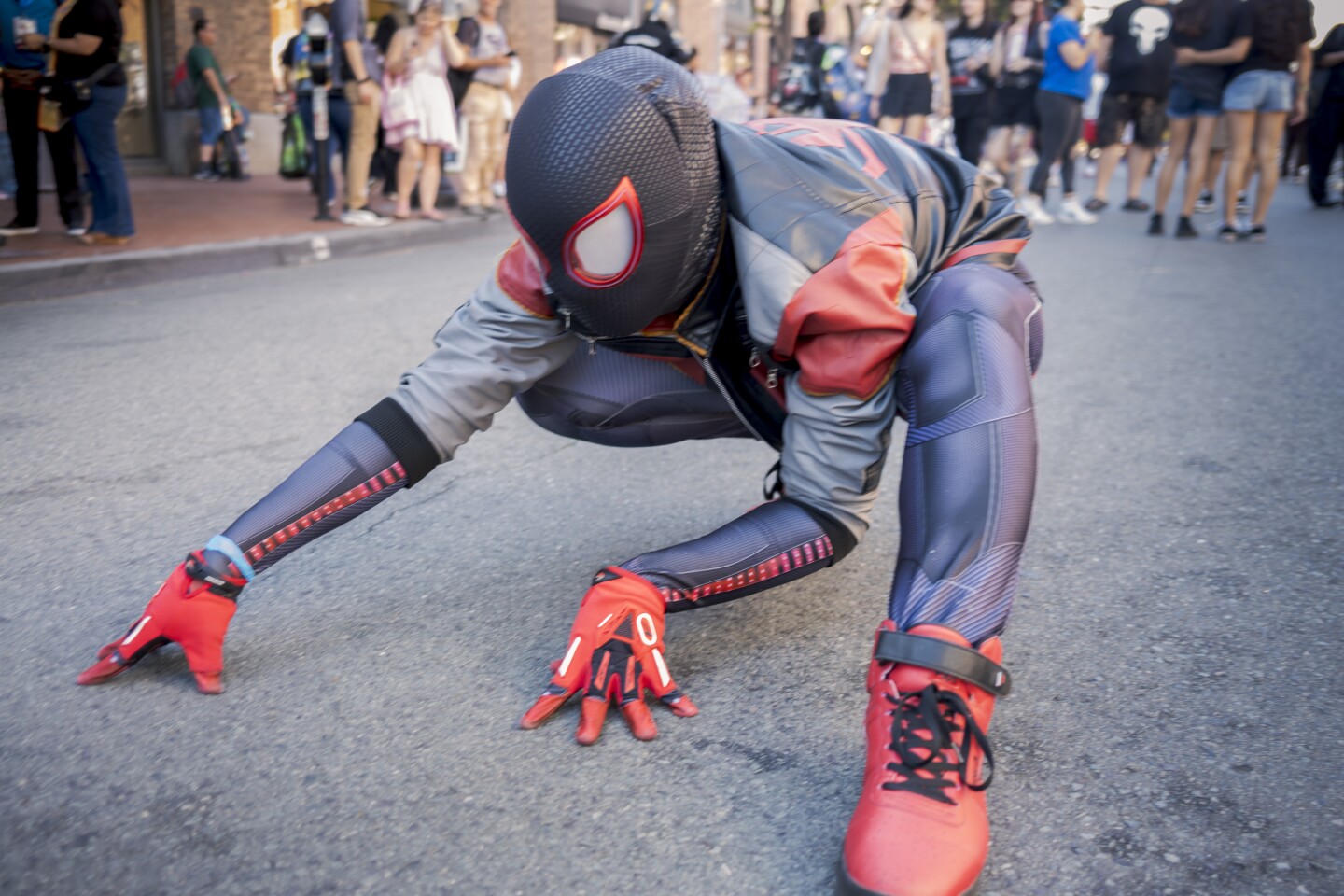 Dressed as Miles Morales, Nicholas Prior poses for a portrait outside Comic-Con on July 25, 2025.