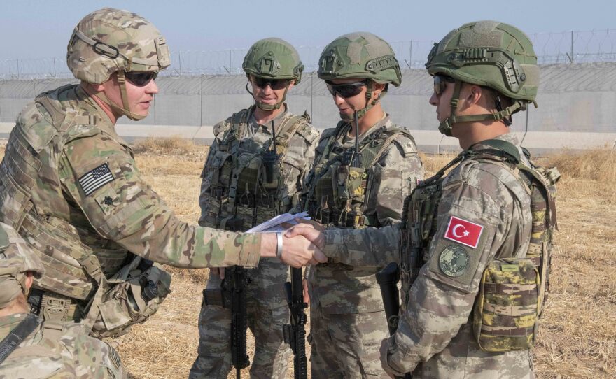 U.S. allies in the Syrian Democratic Forces say the White House's decision to pull troops from the Syria-Turkey border has left them without hope. Here, a U.S. soldier is seen during a joint patrol with Turkish troops on Friday.