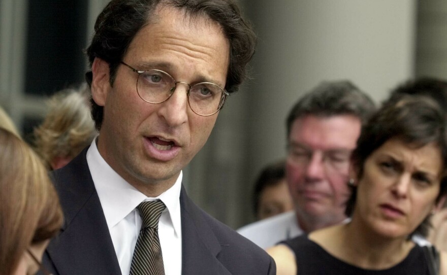 Prosecutor Andrew Weissmann talked with reporters outside the federal courthouse in Houston in 2002. His new book reflects on the past and potential future of the Justice Department.