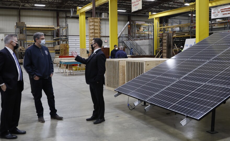 Ryan talks with Don Crane, left, and Lee Daher, representatives from the South Central Ohio Carpenters' Training Center.