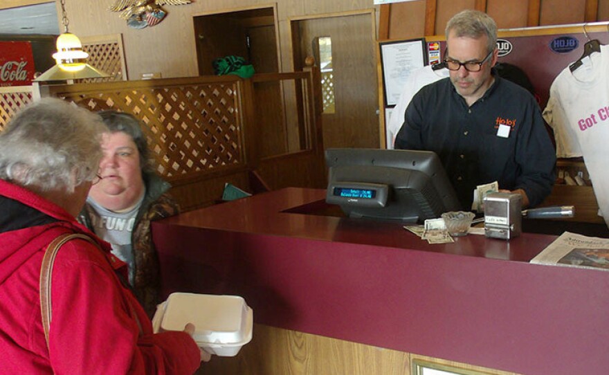 Michael Butler works the counter on the final day of business for a restaurant that opened in 1956.