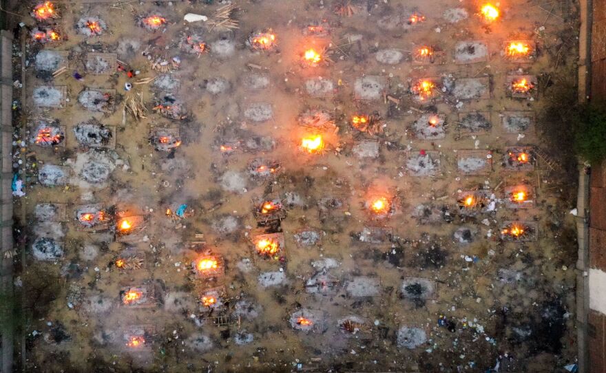 Indians who lost their lives to COVID-19 are cremated in funeral pyres in New Delhi. The aerial photo was taken on April 26.