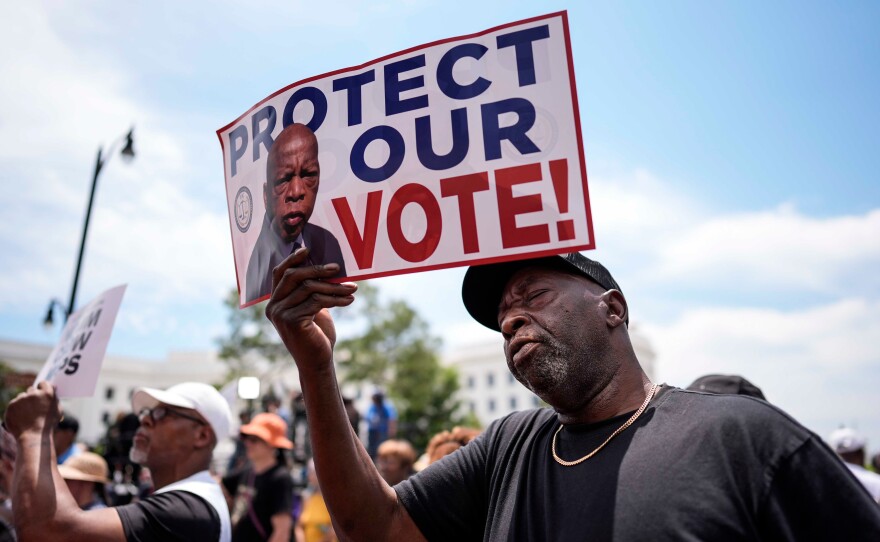 Aaron McGuire sings a spirtual song during a voting rally, Saturday, May 16, 2026, in Montgomery, Ala.