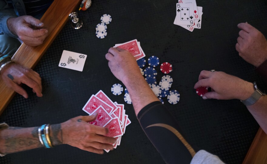 Joe Farrington hosts a weekly poker game on Tuesdays. Some in this group of friends have been playing together for nearly 40 years.
